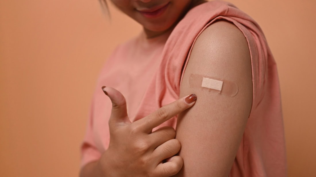 Vaccination information for travellers, injections on arm, health care, vaccination schedule.